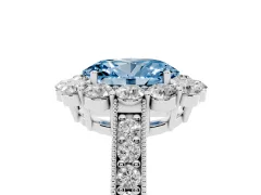 Fancy Blue Oval Cut Diamond Halo Pavé Engagement Ring Set in White gold with Milgrain Detailing
