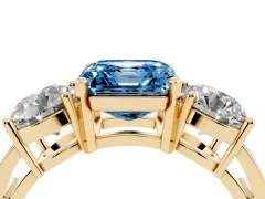 Fancy Blue Asscher Cut Diamond Three-Stone Ring Set in Yellow gold with Round Side Stones and Classic Band
