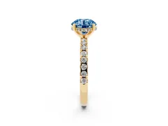 Fancy Blue Round Cut Diamond Pavé Solitaire Ring Set in Yellow gold with Round Band Accents and Prong Setting
