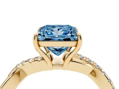 Fancy Blue Princess Cut Diamond Twisted Pavé Band Ring Set in Yellow gold with Prong Setting