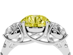 Fancy Yellow Round Cut Diamond Three-Stone Ring Set in Platinum with Pavé Band