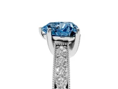Fancy Blue Heart Cut Diamond Solitaire Ring Set in Platinum with Milgrain-Edged Pavé Band and Prong Setting