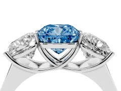 Fancy Blue Cushion Cut Diamond Three-Stone Ring Set in White gold with Plain Polished Band