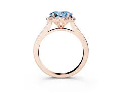 Fancy Blue Oval Cut Diamond Halo Engagement Ring Set in Rose gold with Pavé Band and Rising Shoulders