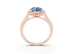Fancy Blue Round Cut Diamond Halo Ring Set in Rose gold with Pavé-Lined Shoulders and Prong Setting