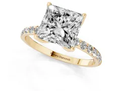 Princess Cut Diamond Solitaire Engagement Ring Set in Yellow gold with Round Pavé Band and Prong Setting