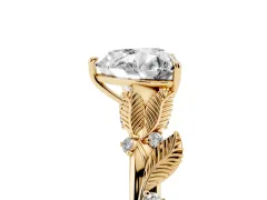 Heart Cut Diamond Solitaire Ring Set in Yellow gold with Leaf Motif Band