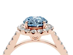 Fancy Blue Oval Cut Diamond Pavé Halo Engagement Ring Set in Rose gold with Pavé Band and Prong Setting