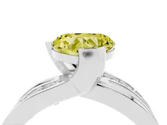 Fancy Yellow Heart Cut Diamond Solitaire Ring Set in White gold with Channel Set Split Shank and Tension Prongs