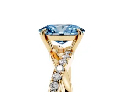 Fancy Blue Oval Cut Diamond Twisted Pavé Band Ring Set in Yellow gold with Prong Setting