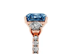 Fancy Blue Asscher Cut Diamond Three-Stone Ring Set in Rose gold with Pavé Band and Graduated Sides