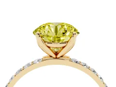 Fancy Yellow Round Cut Diamond Solitaire Engagement Ring Set in Yellow gold with Round Pavé Band and Prong Setting