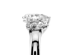 Pear Cut Diamond Three-Stone Ring Set in Platinum with Bold Center and Classic Band