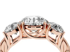 Round Cut Diamond Three-Stone Engagement Ring Set in Rose gold with Milgrain Pavé Band