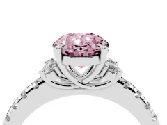Fancy Pink Oval Cut Diamond Three-Stone Pavé Ring Set in Platinum with Prong Setting