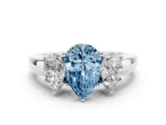 Fancy Blue Pear Cut Diamond Three-Stone Ring Set in Platinum with Bold Center and Classic Band
