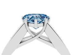 Fancy Blue Heart Cut Diamond Solitaire Ring Set in White gold with Channel-Set Accent Stones and Prong Setting