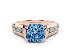 Fancy Blue Cushion Cut Diamond Bezel-Set Solitaire Ring Set in Rose gold with Channel-Set Band