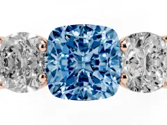 Fancy Blue Cushion Cut Diamond Three-Stone Ring Set in Rose gold with Plain Polished Band