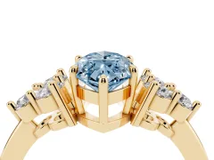 Fancy Blue Marquise Cut Diamond Solitaire Ring Set in Yellow gold with Cluster Accents on Each Side