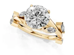 Round Cut Diamond Solitaire Ring Set in Yellow gold with Twisted Marquise Accent Band