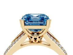 Fancy Blue Asscher Cut Diamond Split Shank Pavé Engagement Ring Set in Yellow gold with Prong-Set Center Stone