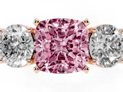 Fancy Pink Cushion Cut Diamond Three-Stone Ring Set in Rose gold with Round Side Stones and Classic Band