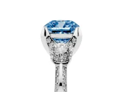 Fancy Blue Cushion Cut Diamond Three-Stone Ring Set in Platinum with Pavé Band and Smaller Side Stones