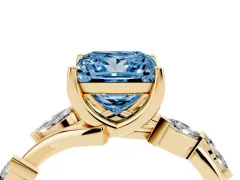 Fancy Blue Princess Cut Diamond Solitaire Ring Set in Yellow gold with Twisted Marquise Accent Band