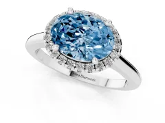 Fancy Blue Oval Cut Diamond Halo Engagement Ring Set in Silver with Pavé Band and Rising Shoulders