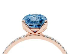 Fancy Blue Radiant Cut Diamond Solitaire Engagement Ring Set in Rose gold with Round Pavé Band and Prong Setting