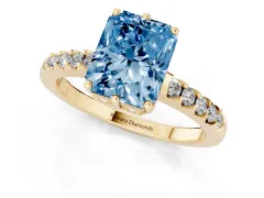 Fancy Blue Radiant Cut Diamond Solitaire Engagement Ring Set in Yellow gold with Pavé Band and Prong Setting