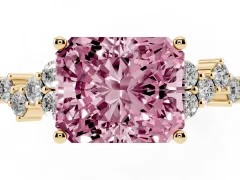 Fancy Pink Radiant Cut Diamond Ring Set in Yellow gold with Scattered Round Accents