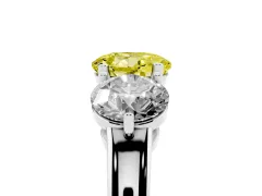 Fancy Yellow Round Cut Diamond Three-Stone Ring Set in White gold with Prong Setting and Plain Band