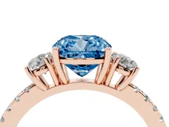 Fancy Blue Cushion Cut Diamond Three-Stone Ring Set in Rose gold with Pavé Band and Graduated Sides