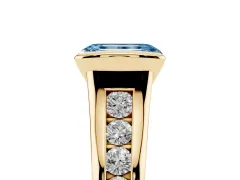 Fancy Blue Emerald Cut Diamond Bezel-Set Solitaire Ring Set in Yellow gold with Channel-Set Band