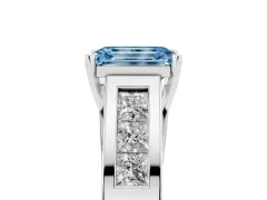 Fancy Blue Emerald Cut Diamond Solitaire Ring Set in White gold with Channel-Set Accent Stones and Prong Setting