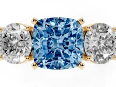 Fancy Blue Cushion Cut Diamond Three-Stone Ring Set in Yellow gold with Round Side Stones and Classic Band