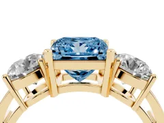 Fancy Blue Princess Cut Diamond Three-Stone Ring Set in Yellow gold with Round Side Stones and Classic Band