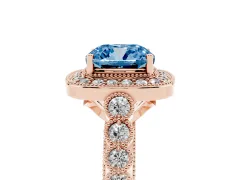 Fancy Blue Cushion Cut Diamond Milgrain Halo Solitaire Ring Set in Rose gold with Bezel Set Side Stones and Pavé Band