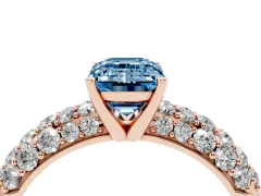 Fancy Blue Emerald Cut Diamond Pavé Band Solitaire Ring Set in Rose gold with Close-Set Accent Stones and Prong Setting