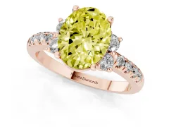 Fancy Yellow Oval Cut Diamond Three-Stone Pavé Ring Set in Rose gold with Prong Setting