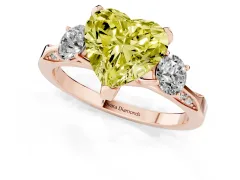 Fancy Yellow Heart Cut Diamond Three-Stone Ring Set in Rose gold with Pavé Band and Smaller Side Stones