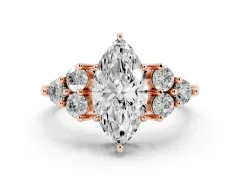 Marquise Cut Diamond Solitaire Ring Set in Rose gold with Cluster Accents on Each Side