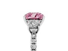 Fancy Pink Cushion Cut Diamond Three-Stone Ring Set in Platinum with Pavé Band and Graduated Sides