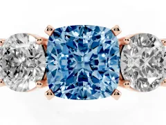 Fancy Blue Cushion Cut Diamond Three-Stone Ring Set in Rose gold with Round Side Stones and Classic Band