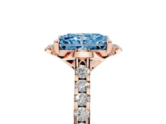 Fancy Blue Radiant Cut Diamond Solitaire Ring Set in Rose gold with Pavé Band and Floral Prong Setting