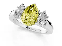 Fancy Yellow Pear Cut Diamond Three-Stone Ring Set in White gold with Bold Center and Classic Band