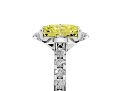 Fancy Yellow Radiant Cut Diamond Solitaire Ring Set in White gold with Pavé Band and Floral Prong Setting
