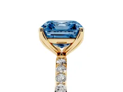 Fancy Blue Asscher Cut Diamond Solitaire Engagement Ring Set in Yellow gold with Round Pavé Band and Prong Setting